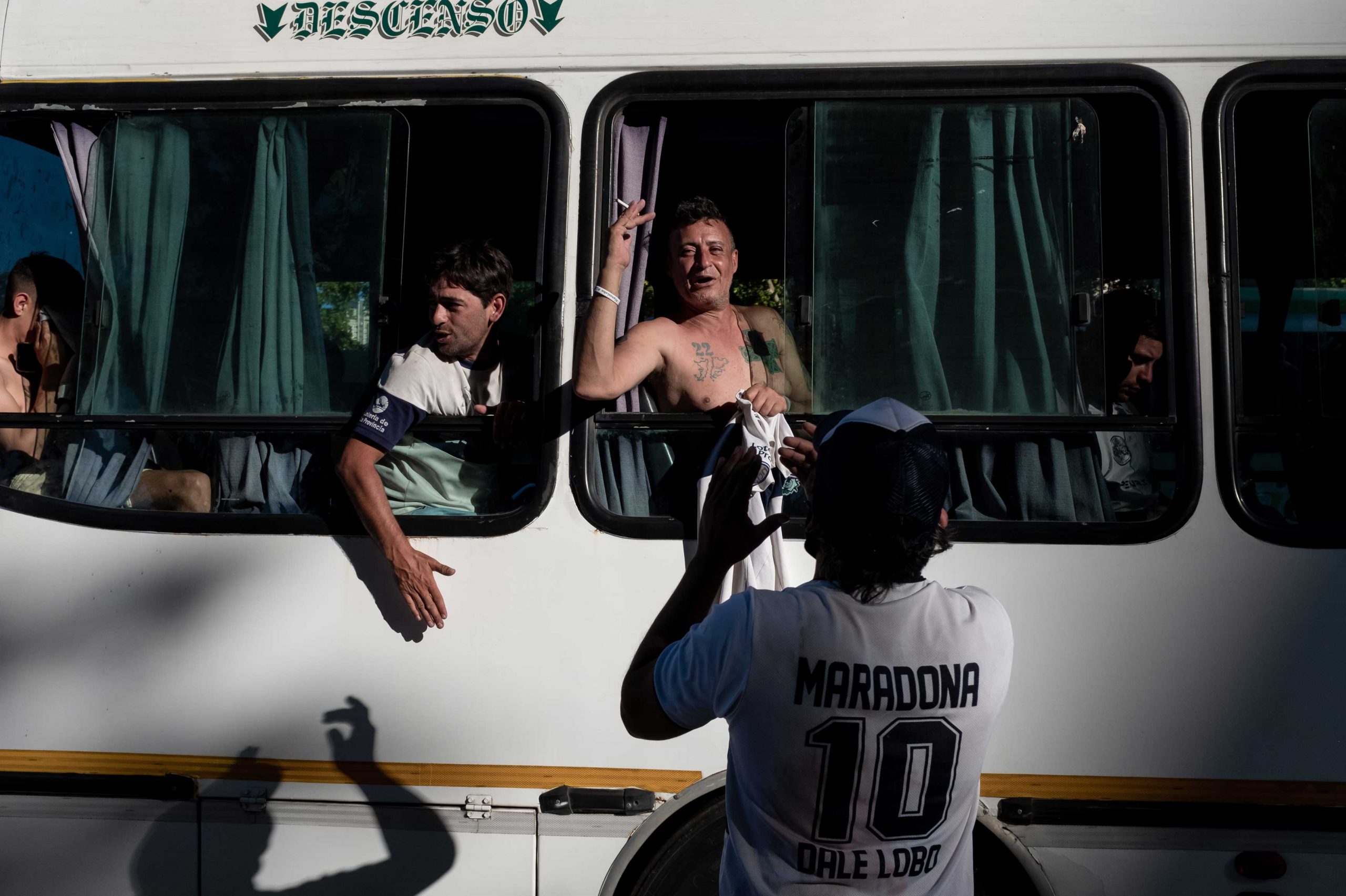 Fans of Maradona on a coach bus.